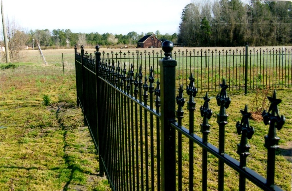Custom Star Finials on Iron Fence