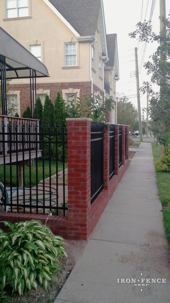 Brick and masonry work pair beautifully with our iron and aluminum fence